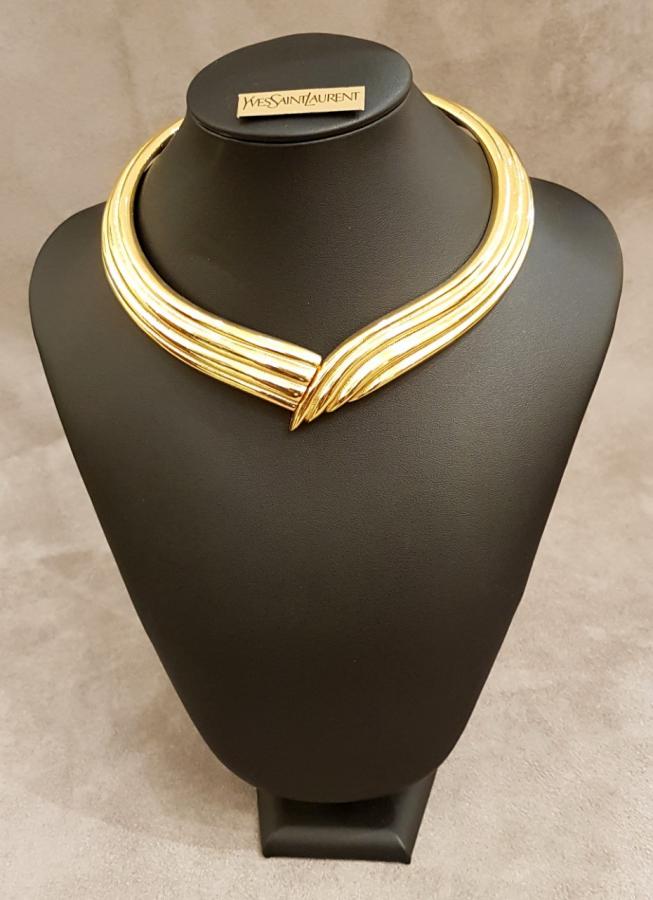 YVES SAINT LAURENT   Golden metal torque necklace, More Informations...